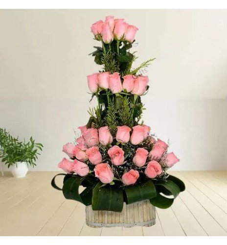 Beautiful Basket of Pink Roses with Leaves