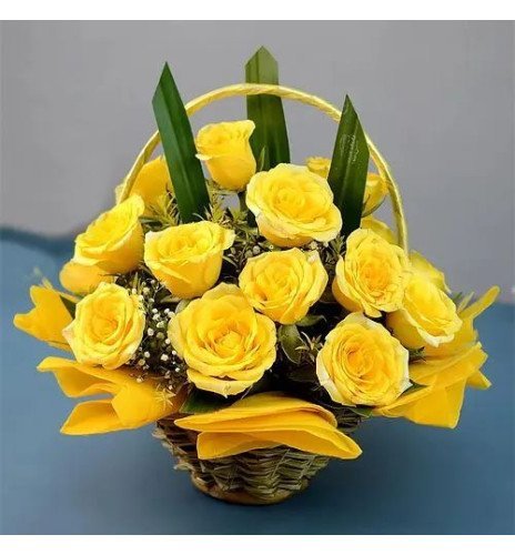 Cheerful Basket of Sun kissed Yellow Roses with Greens