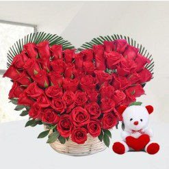 Red roses heart with teddy