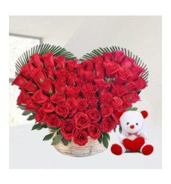 Red roses heart with teddy